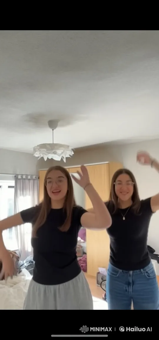 Girls Dance and Embrace in Cozy Room Setting – AI Generated Video | Hailuo AI