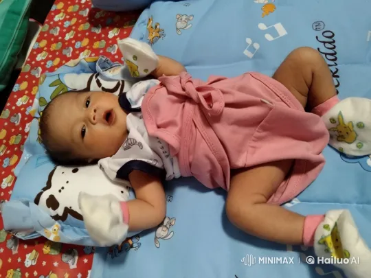 Baby's Playful Fight Mimicry on Colorful Mat – AI Generated Video | Hailuo AI