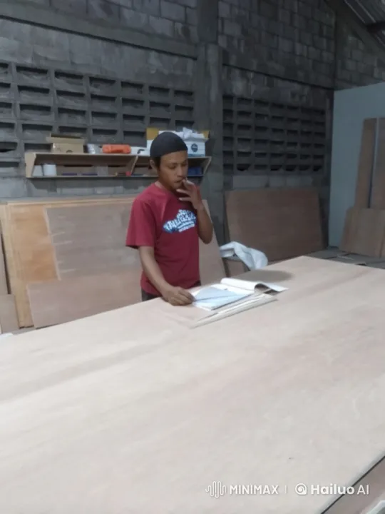 Workshop Scene: Person Examining Book with Live2D Animation – AI Generated Video | Hailuo AI