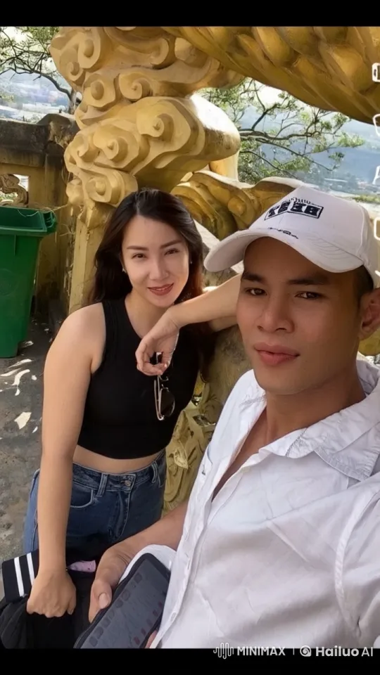 Couple Enjoying Leisure Time at Ornamental Structure – AI Generated Video | Hailuo AI