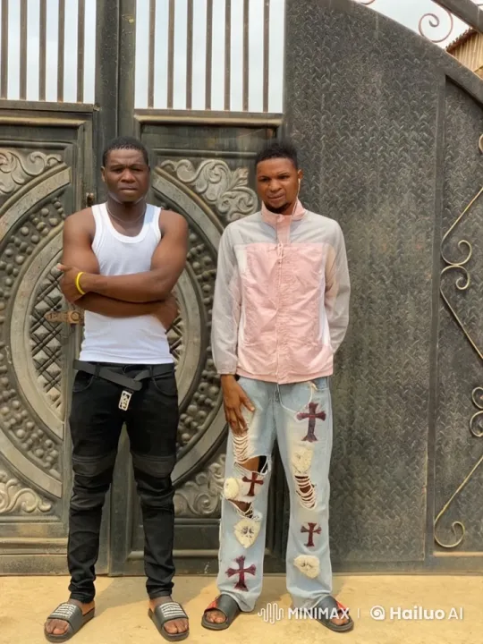 Young Men Display Martial Arts Skills in Front of Metal Gate – AI Generated Video | Hailuo AI