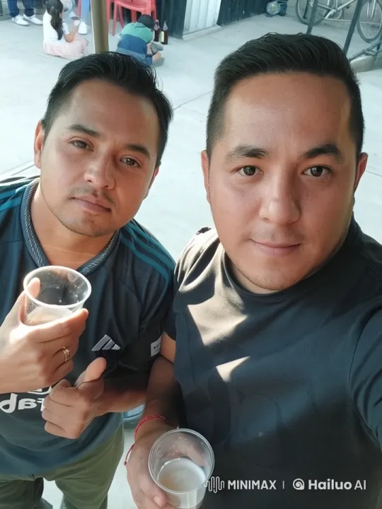 Two Friends Share Affectionate Kiss at Outdoor Gathering – AI Generated Video | Hailuo AI
