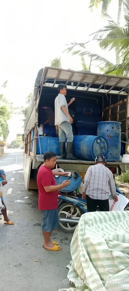 Team Unloading Blue Barrels from Truck in Lush Setting – AI Generated Video | Hailuo AI
