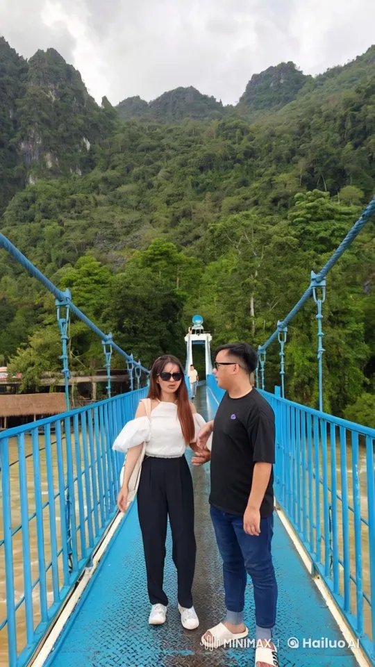 Couple Displays Kung Fu Mastery on Mountain Bridge – AI Generated Video | Hailuo AI