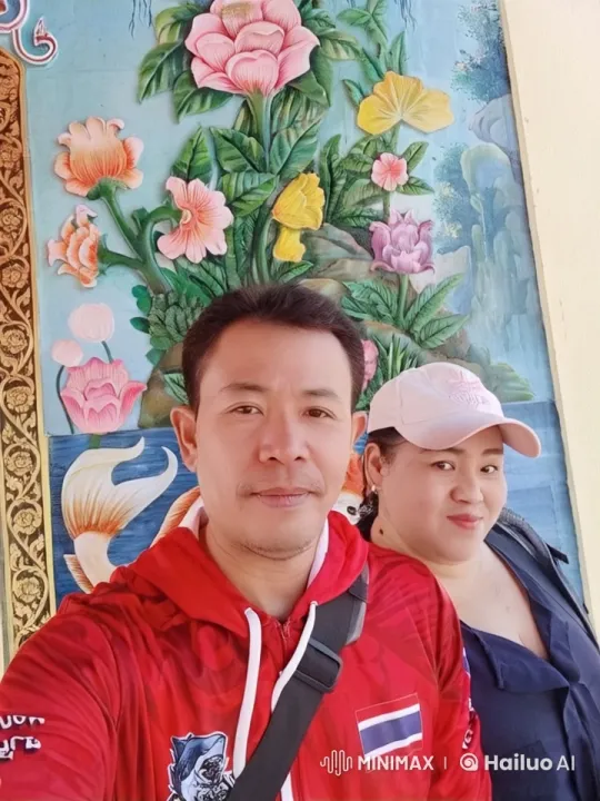 Kung Fu Practitioners Display Skills in Front of Floral Mural – AI Generated Video | Hailuo AI