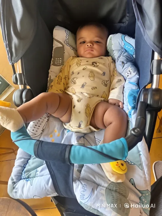 Baby's Joyful Play in Stroller with Soft, Colorful Setting – AI Generated Video | Hailuo AI