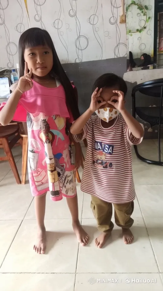 Two Children in Playful Stance in a Colorful Room – AI Generated Video | Hailuo AI