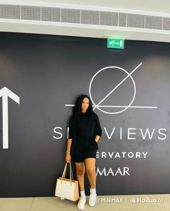 Young Woman Struts Gracefully at Sky Views Observatory – AI Generated Video | Hailuo AI