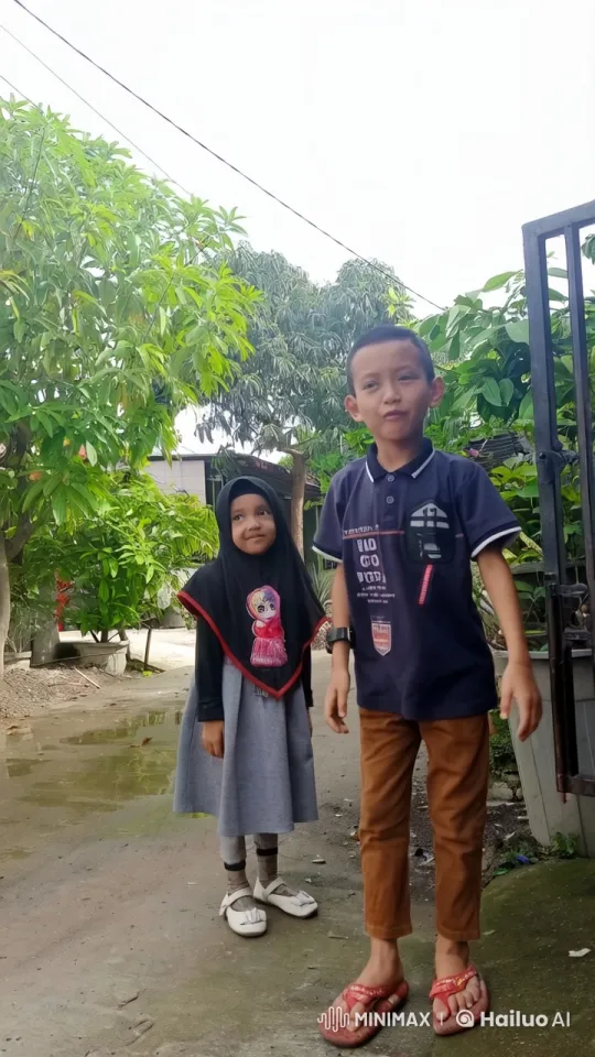 Young Boy Practices Kungfu, Girl Mimics in Lush Outdoor Setting – AI Generated Video | Hailuo AI