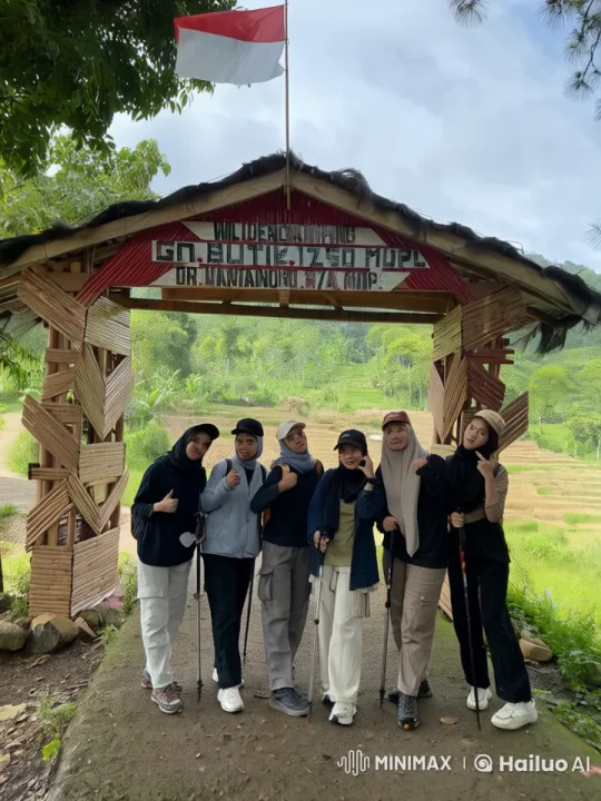 Hikers Engage in Playful Kungfu Under Scenic Arch – AI Generated Video | Hailuo AI