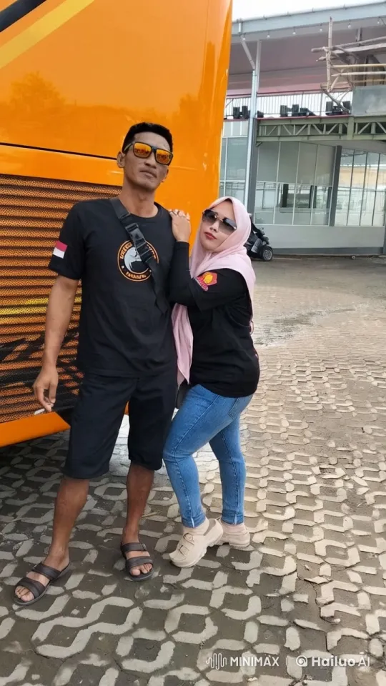 Couple Practicing Kung Fu by Bright Orange Bus – AI Generated Video | Hailuo AI