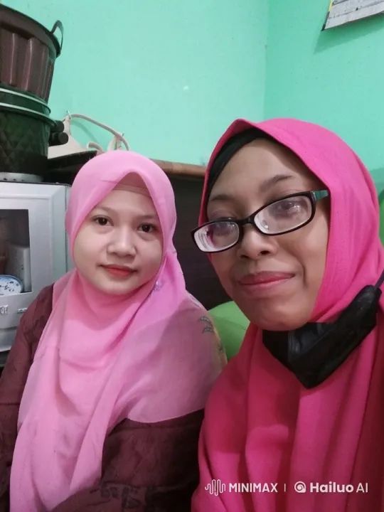 Two Women in Pink Hijabs in Cozy, Live2D Animated Room – AI Generated Video | Hailuo AI