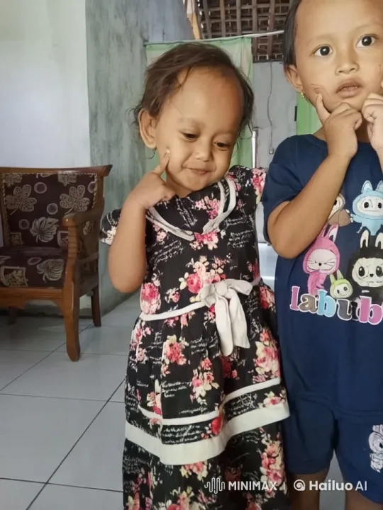 Children Playfully Jump and Kick in Cozy Indoor Setting – AI Generated Video | Hailuo AI