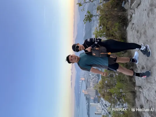 Martial Arts Showdown on Mountain with Cityscape – AI Generated Video | Hailuo AI