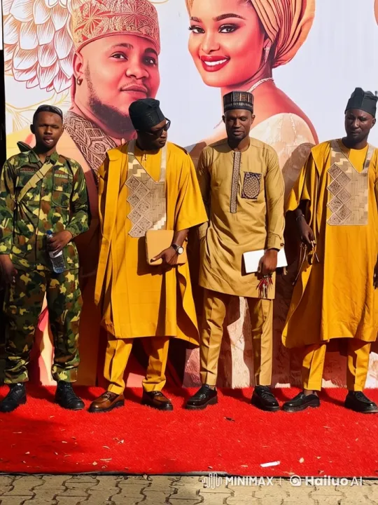Four Men in Traditional Attire Celebrate on Red Carpet – AI Generated Video | Hailuo AI
