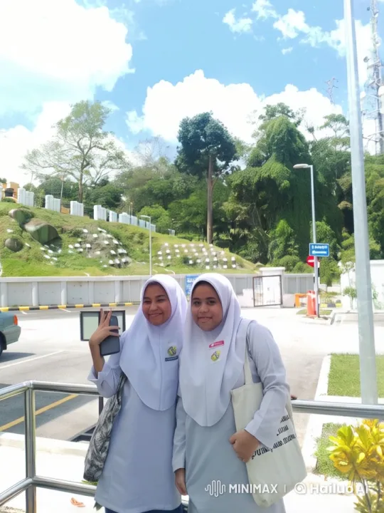 Students in Hijabs Pose with Bags in Sunny Outdoor Scene – AI Generated Video | Hailuo AI