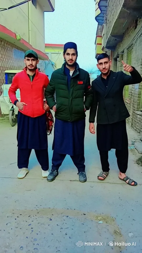 Three Men in Traditional Attire Interact on Narrow Street – AI Generated Video | Hailuo AI