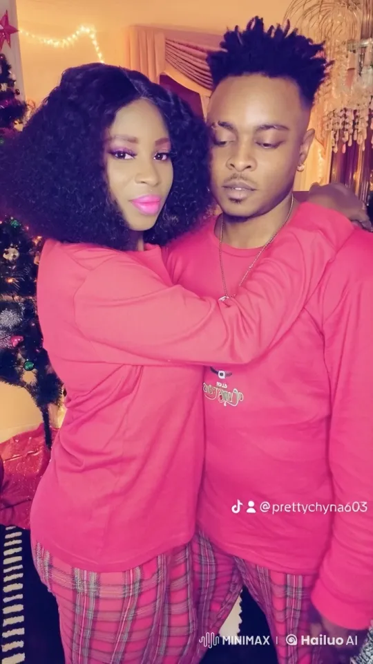 Christmas Intimacy: Couple in Red Pajamas by Twinkling Tree – AI Generated Video | Hailuo AI