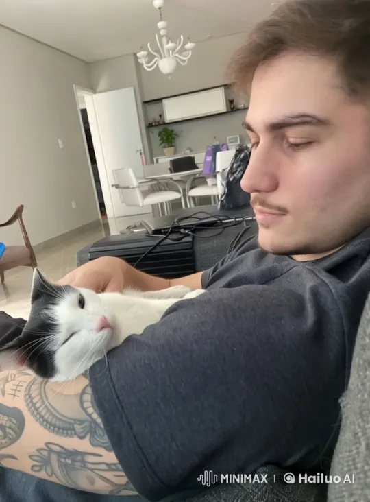 Cozy Moment: Person and Cat's Tender Interaction – AI Generated Video | Hailuo AI