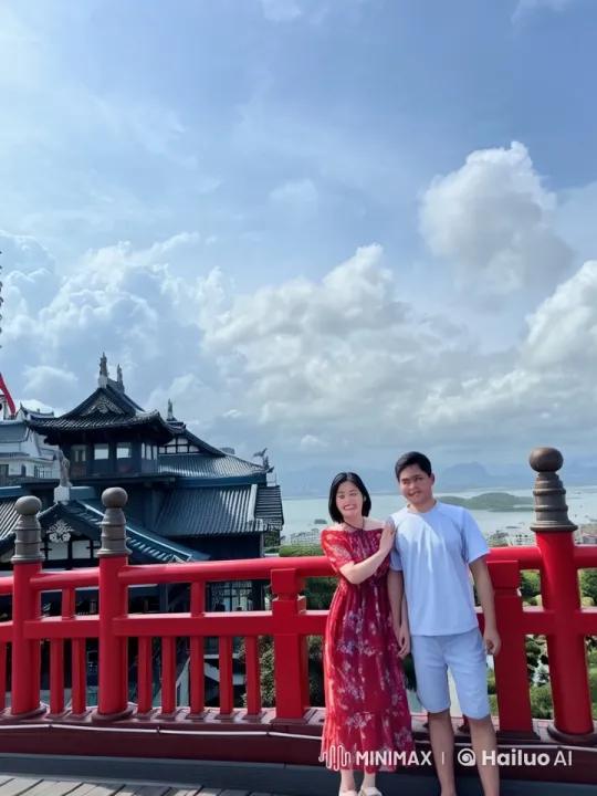 Dynamic Martial Arts Scene on Red Bridge with Traditional Japanese Architecture Background – AI Generated Video | Hailuo AI