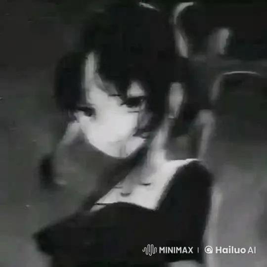 Serene Portrait of a Young Woman in a Grayscale Setting – AI Generated Video | Hailuo AI