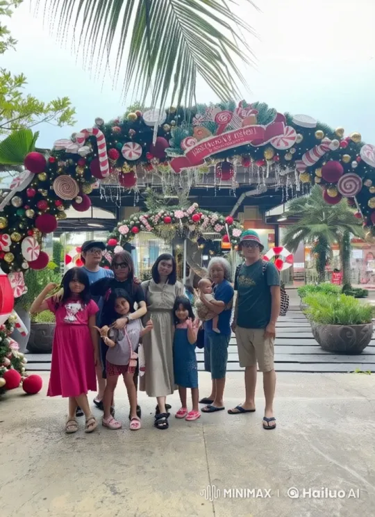 Christmas Family Celebrates with Kungfu Under Festive Archway – AI Generated Video | Hailuo AI