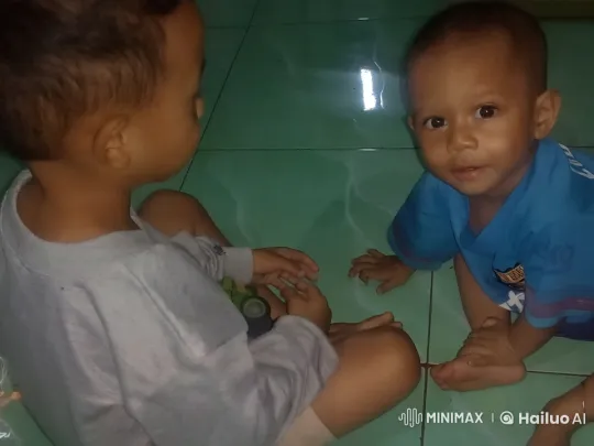 Two Children Playfully Mimic Kungfu on the Floor – AI Generated Video | Hailuo AI
