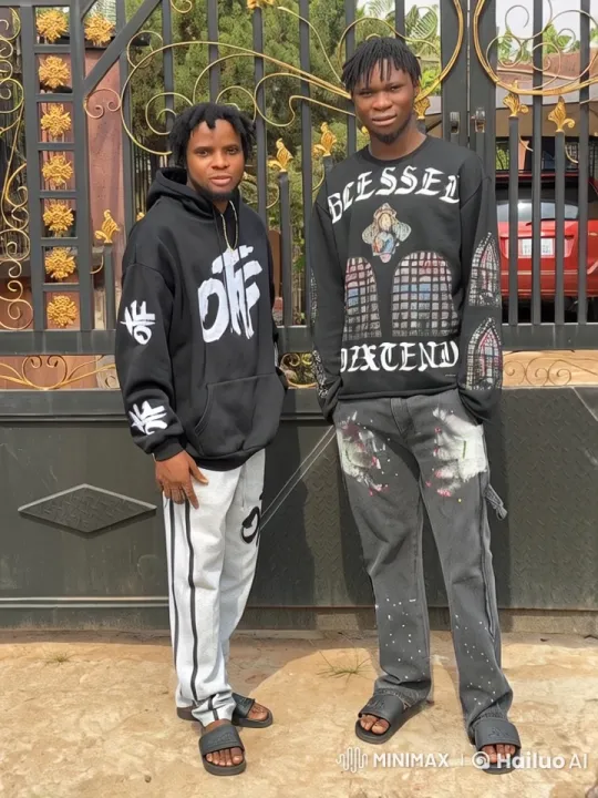 Two Men in Streetwear by an Ornate Gate – AI Generated Video | Hailuo AI
