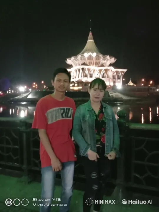 Nocturnal Martial Arts Display Near Illuminated Building – AI Generated Video | Hailuo AI