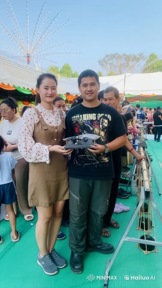 Couple Performs Dynamic Martial Arts in Festive Market Setting – AI Generated Video | Hailuo AI