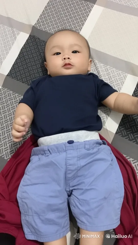 Baby Performing Kung Fu on Patterned Bedspread – AI Generated Video | Hailuo AI