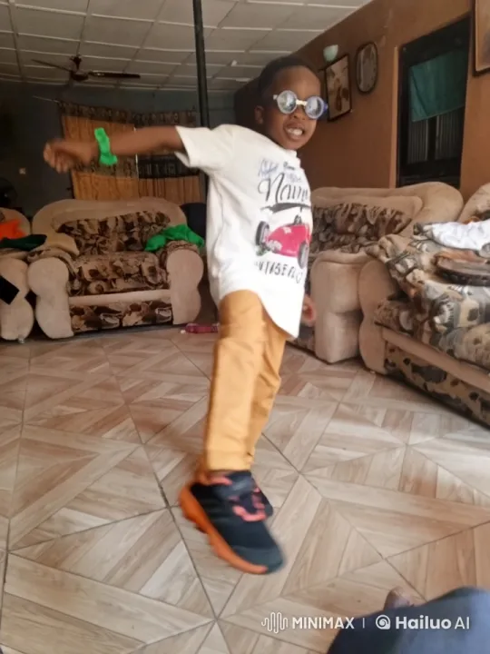 Boy Dancing Playfully in Cozy Living Room – AI Generated Video | Hailuo AI