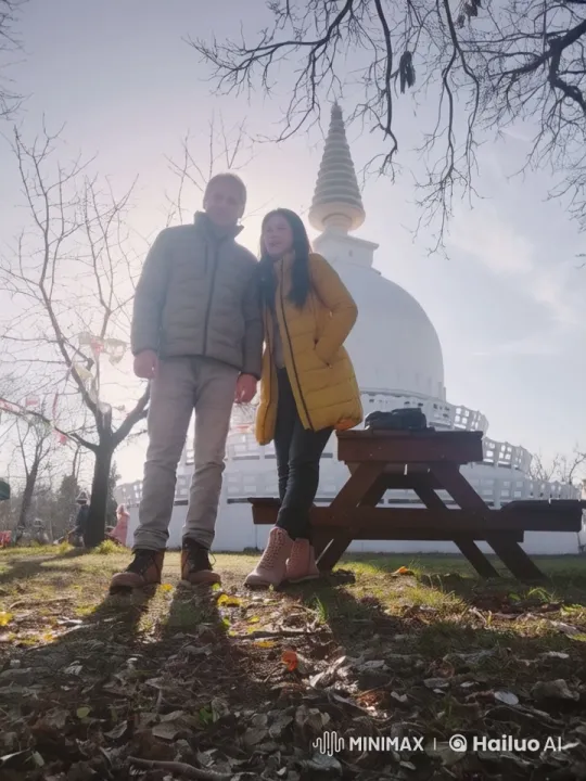 Couple Shares Joyful Moment Near Stupa in Park – AI Generated Video | Hailuo AI