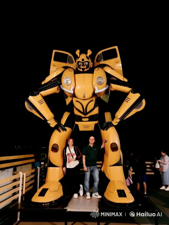 Bumblebee Robot Dances with Posers in Nighttime Setting – AI Generated Video | Hailuo AI
