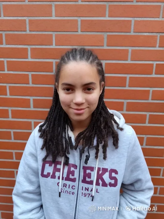 Young Individual in Gray Hoodie with Dreadlocks – AI Generated Video | Hailuo AI