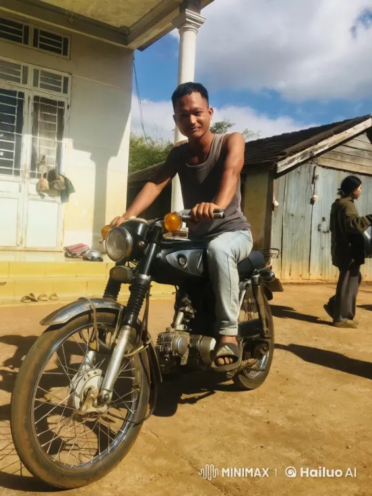 Vintage Motorcycle and Man in Rural Setting – AI Generated Video | Hailuo AI