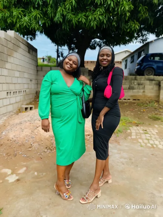 Two Women in Elegant Dresses Pose Under a Tree – AI Generated Video | Hailuo AI