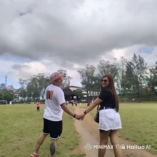 Couple Playfully Interacting in a Grass Field – AI Generated Video | Hailuo AI