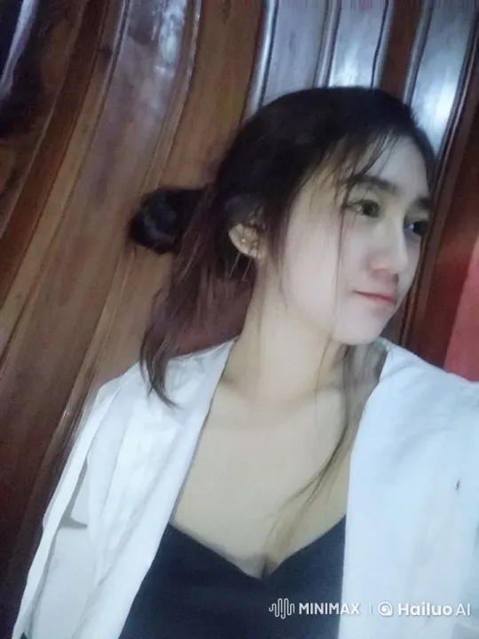Relaxed Young Woman in White Jacket Against Wooden Wall – AI Generated Video | Hailuo AI