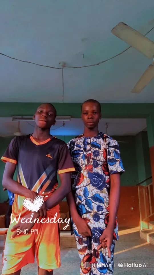 Two Individuals Standing Side by Side in a Colorful Setting – AI Generated Video | Hailuo AI
