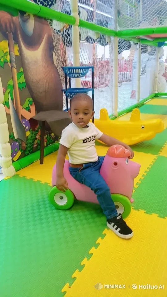 Child Practicing Kungfu on Toy in Colorful Play Area – AI Generated Video | Hailuo AI