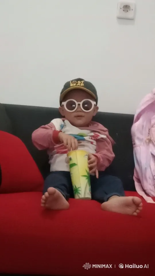 Child Enacts Playful Kungfu Moves on Red Couch – AI Generated Video | Hailuo AI
