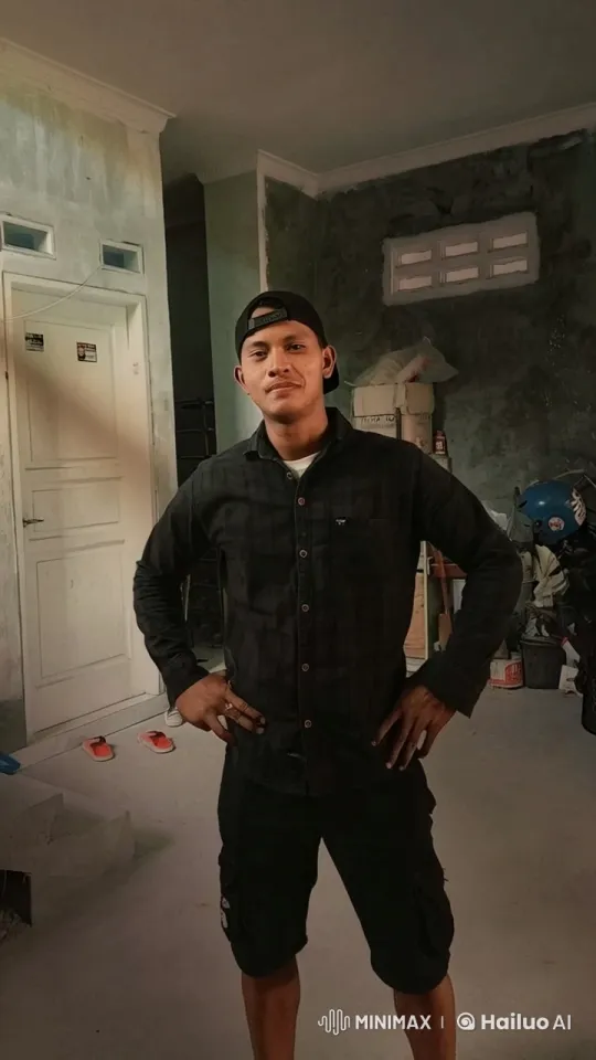 Confident Young Man Showcases Fitness in Renovation Setting – AI Generated Video | Hailuo AI