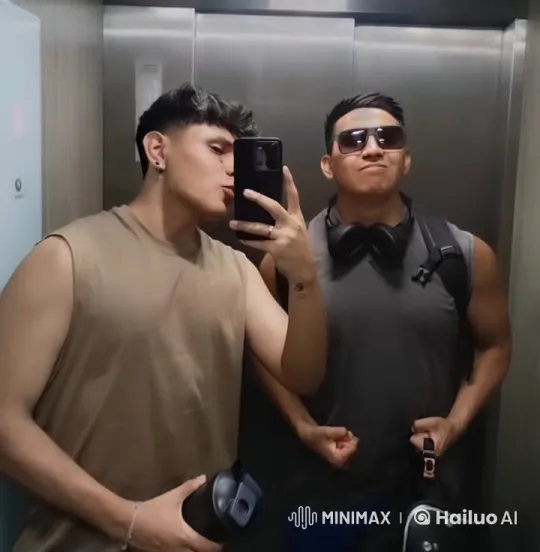 Two Friends Share a Cheek Kiss in an Elevator – AI Generated Video | Hailuo AI