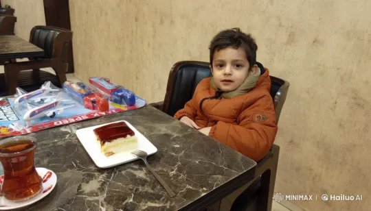 Child in Orange Jacket Enjoying Dessert in Cozy Cafe – AI Generated Video | Hailuo AI