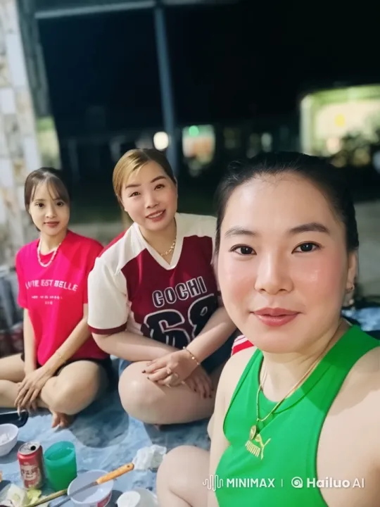 Three Women Chatting Casually on a Mat at Night – AI Generated Video | Hailuo AI