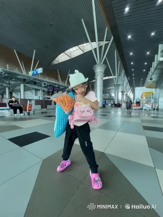 Girl and Fireflies Enchant Modern Airport Terminal – AI Generated Video | Hailuo AI