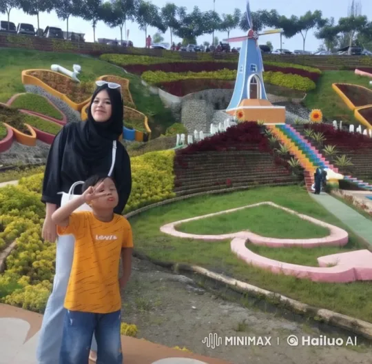 Woman in Black Watches Boy Perform Kungfu in Colorful Garden – AI Generated Video | Hailuo AI