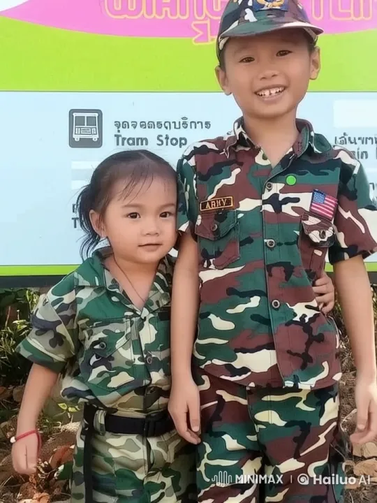 Children in Military Uniforms at Tram Stop – AI Generated Video | Hailuo AI