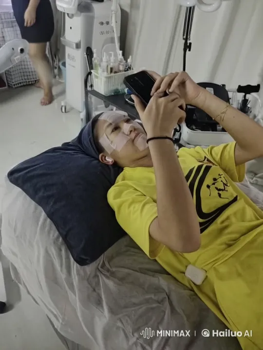 Person on Bed Engages with Smartphone in Medical Setting – AI Generated Video | Hailuo AI